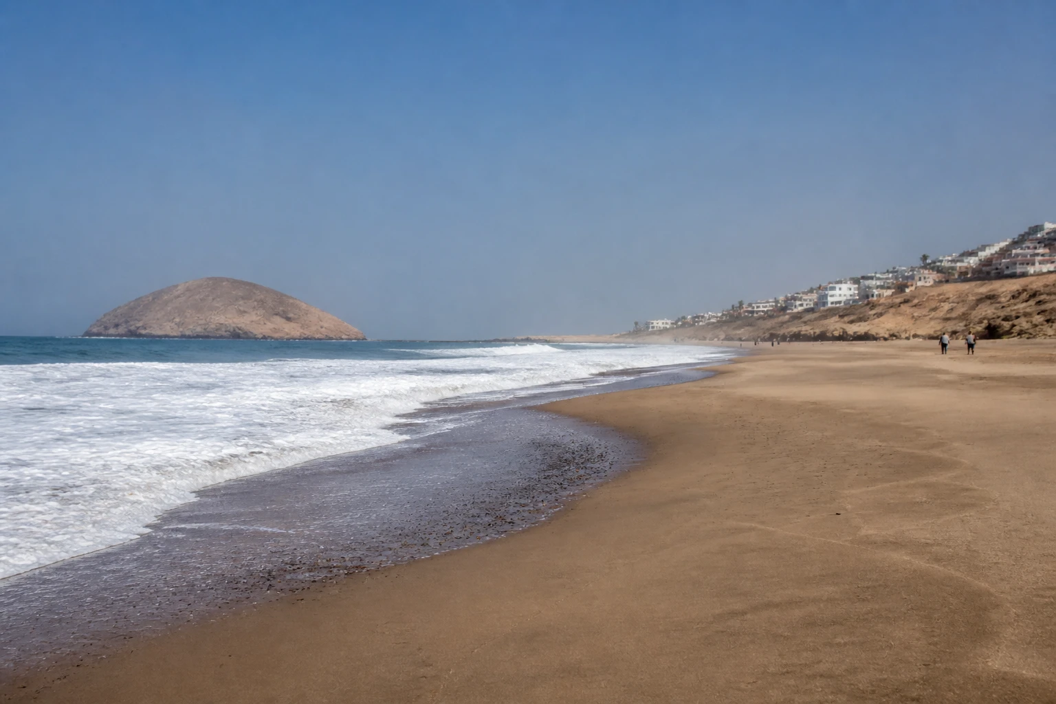 Sandy shoreline and surf at San Bartolo near Lima