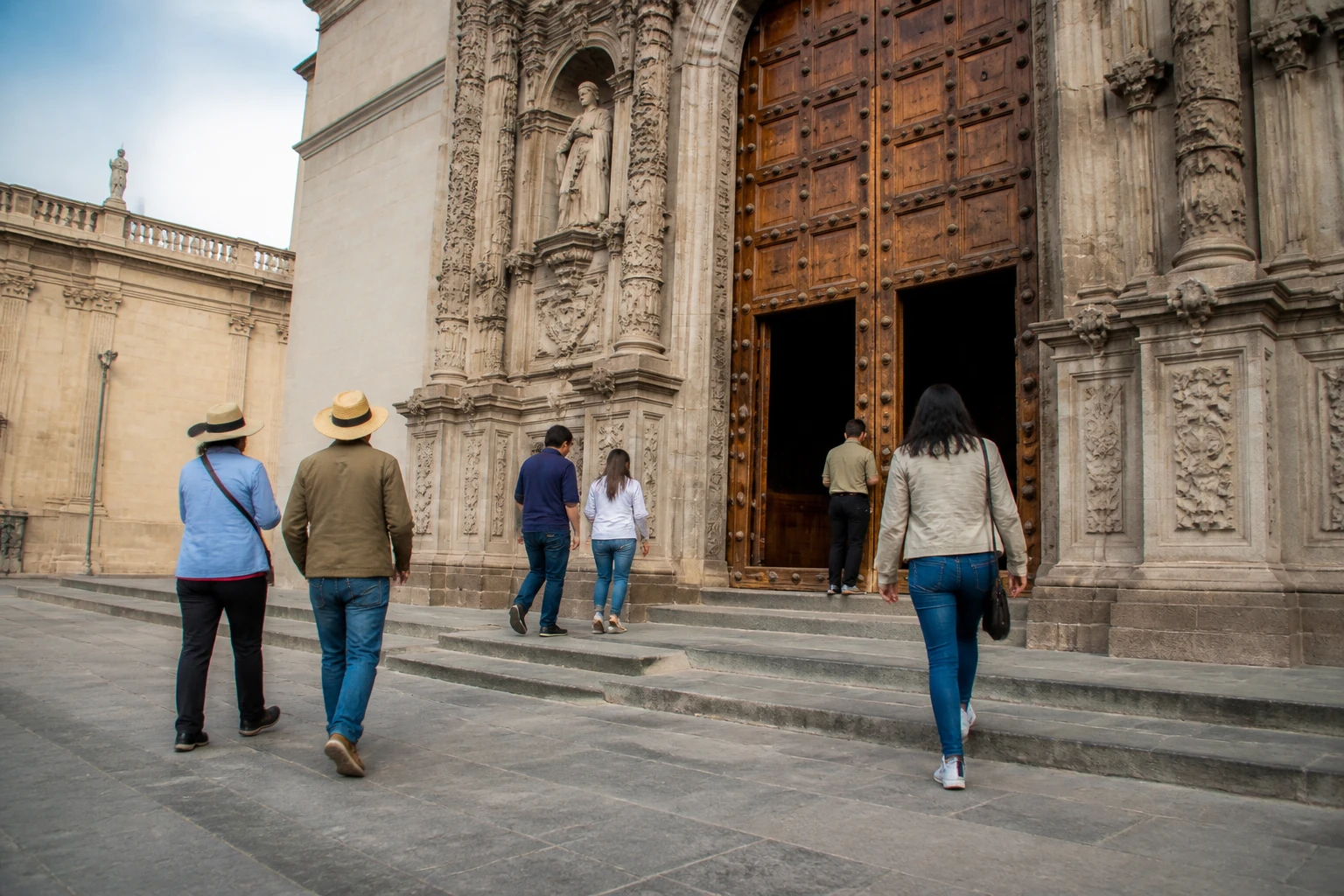 Visitors approaching a historic church in Lima’s Historic Center