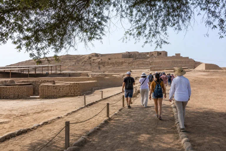 Visitors walking through the outdoor archaeological complex at Pachacamac in Lurín
