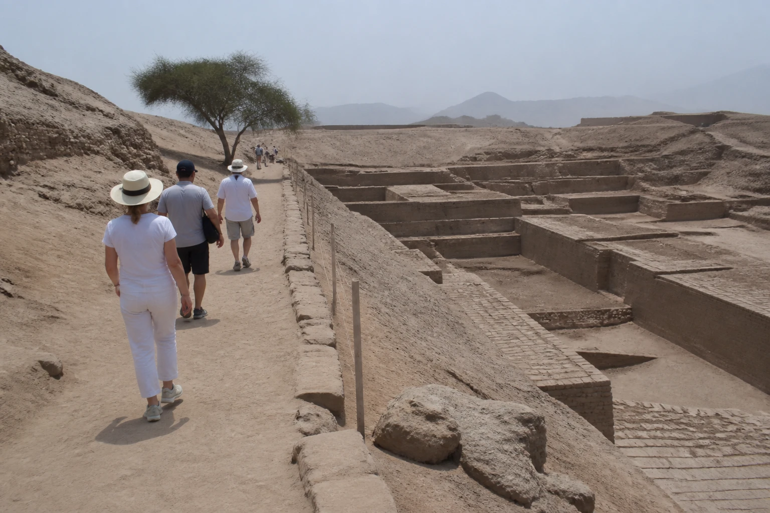 Visitors following an established trail near protected archaeological remains at Pachacamac